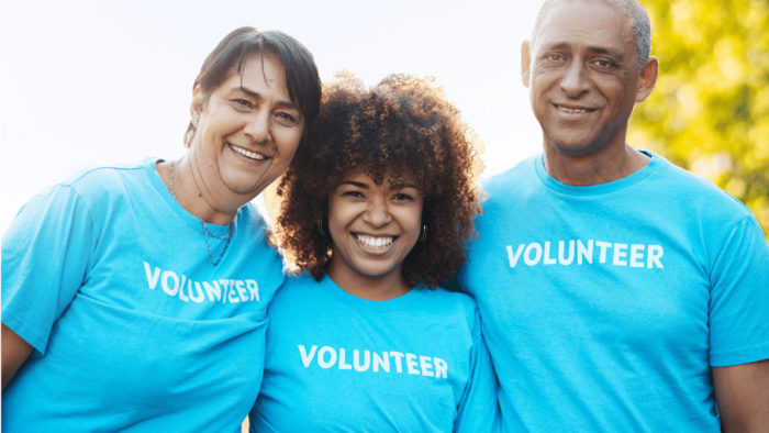 Nonprofit volunteers smiling for the camera