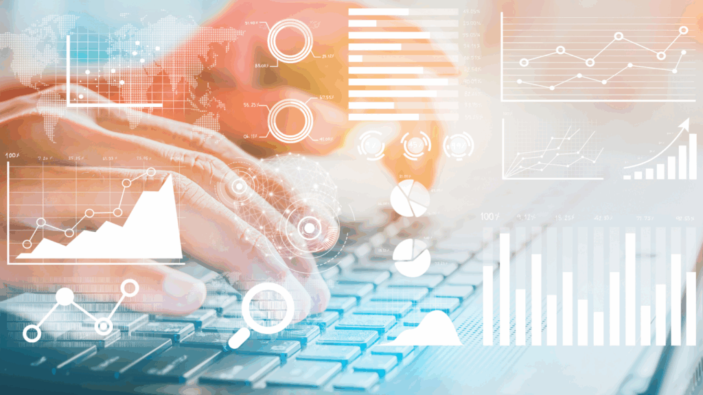 Laptop with hands on keyboard and data icons surrounding